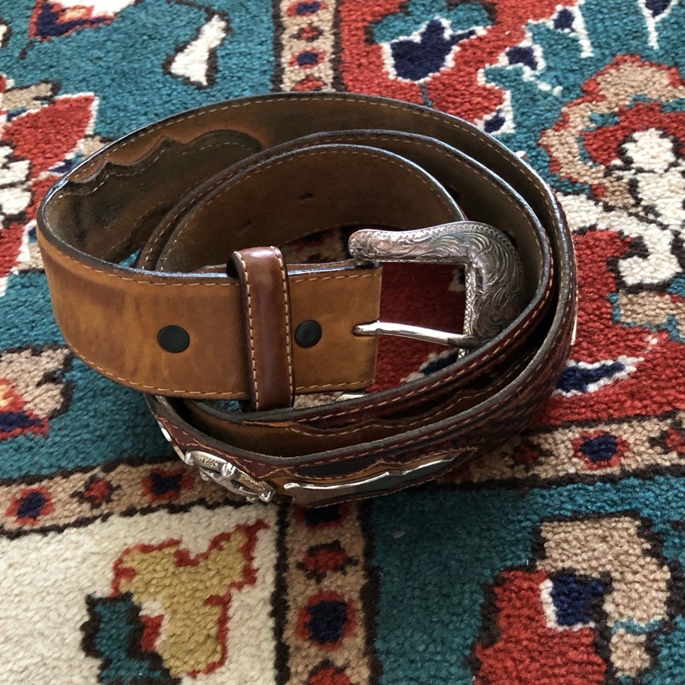 Brown leather belt with “silver” star accents